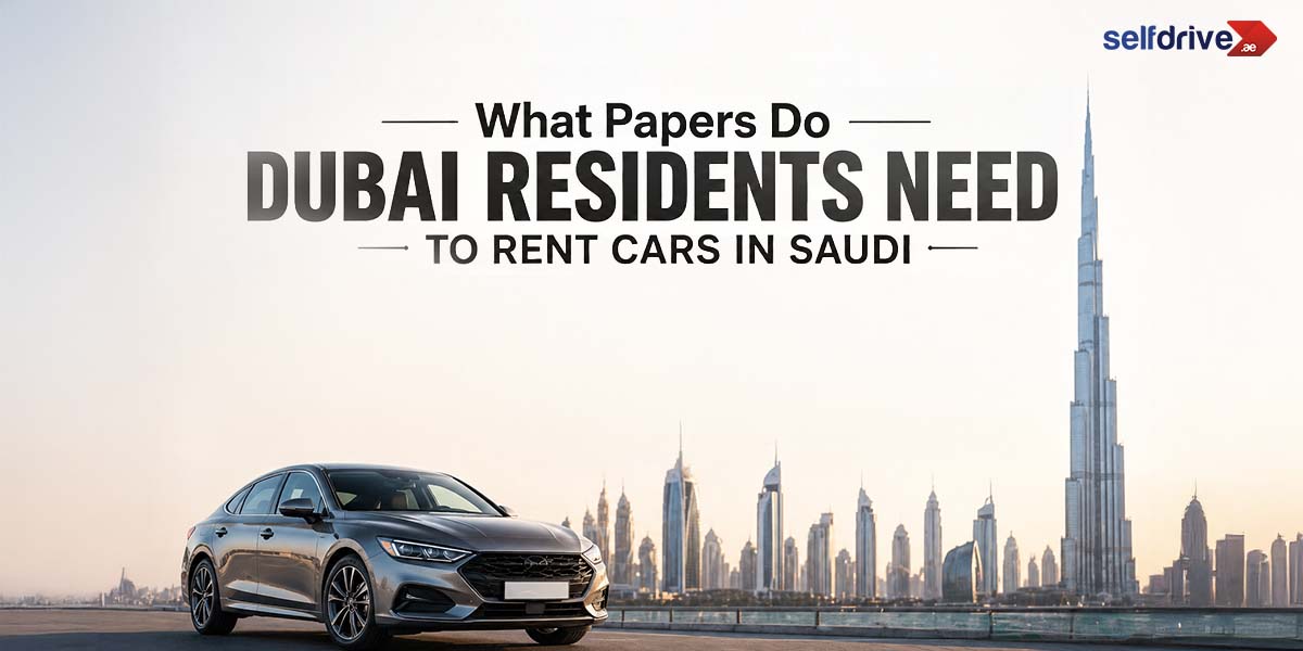 A sleek car on a road with the Dubai skyline in the background at sunset. Text: "What Papers Do Dubai Residents Need to Rent Cars in Saudi?" Logo: selfdrive.ae.
