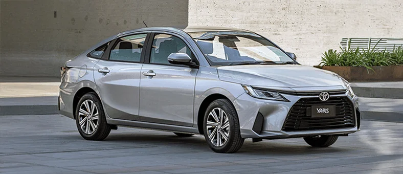 Silver Toyota Yaris sedan available for monthly car hire in Dubai via Selfdrive